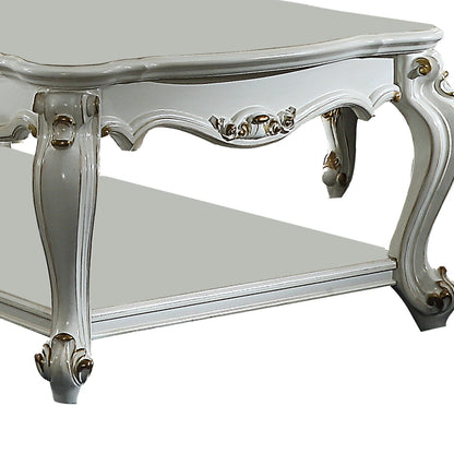 Benjara Traditional Style Wooden Coffee Table with Polyresin Carvings And Bottom Shelf, White