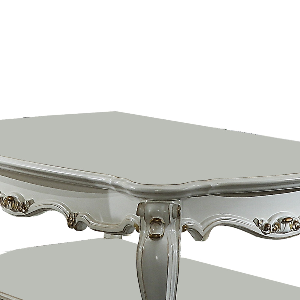 Benjara Traditional Style Wooden Coffee Table with Polyresin Carvings And Bottom Shelf, White