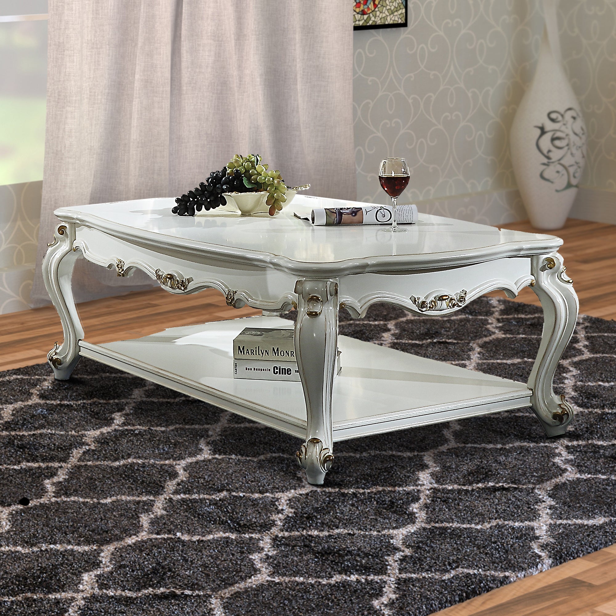 Benjara Traditional Style Wooden Coffee Table with Polyresin Carvings And Bottom Shelf, White