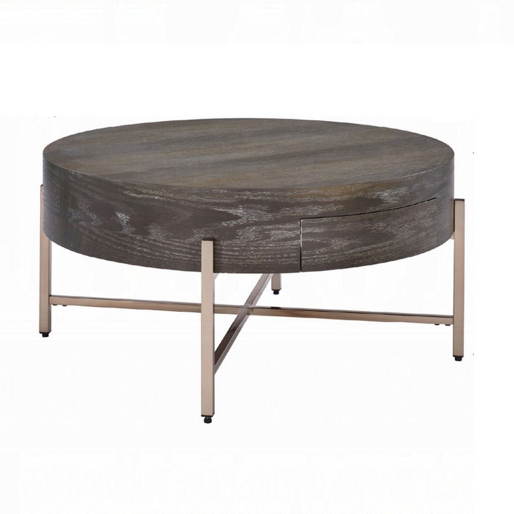 Benjara 1 Drawer Round Modern Coffee Table with Crossed Metal Legs, Brown And Gold