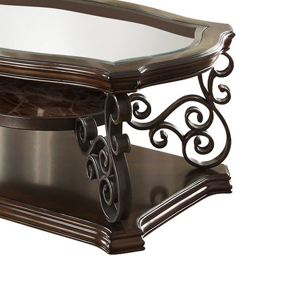 Benjara Tempered Glass Top Wooden Coffee Table with Ornate Metal Scrollwork, Brown