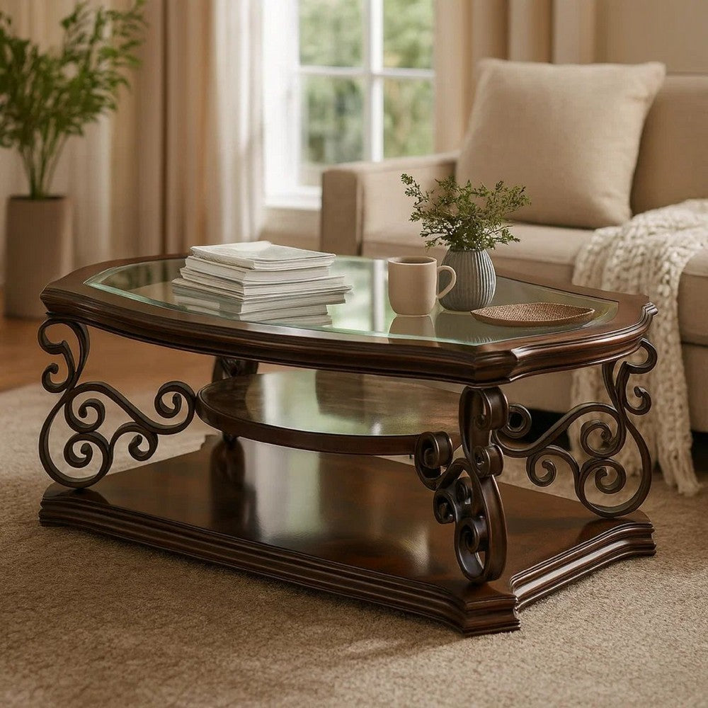 Benjara Tempered Glass Top Wooden Coffee Table with Ornate Metal Scrollwork, Brown