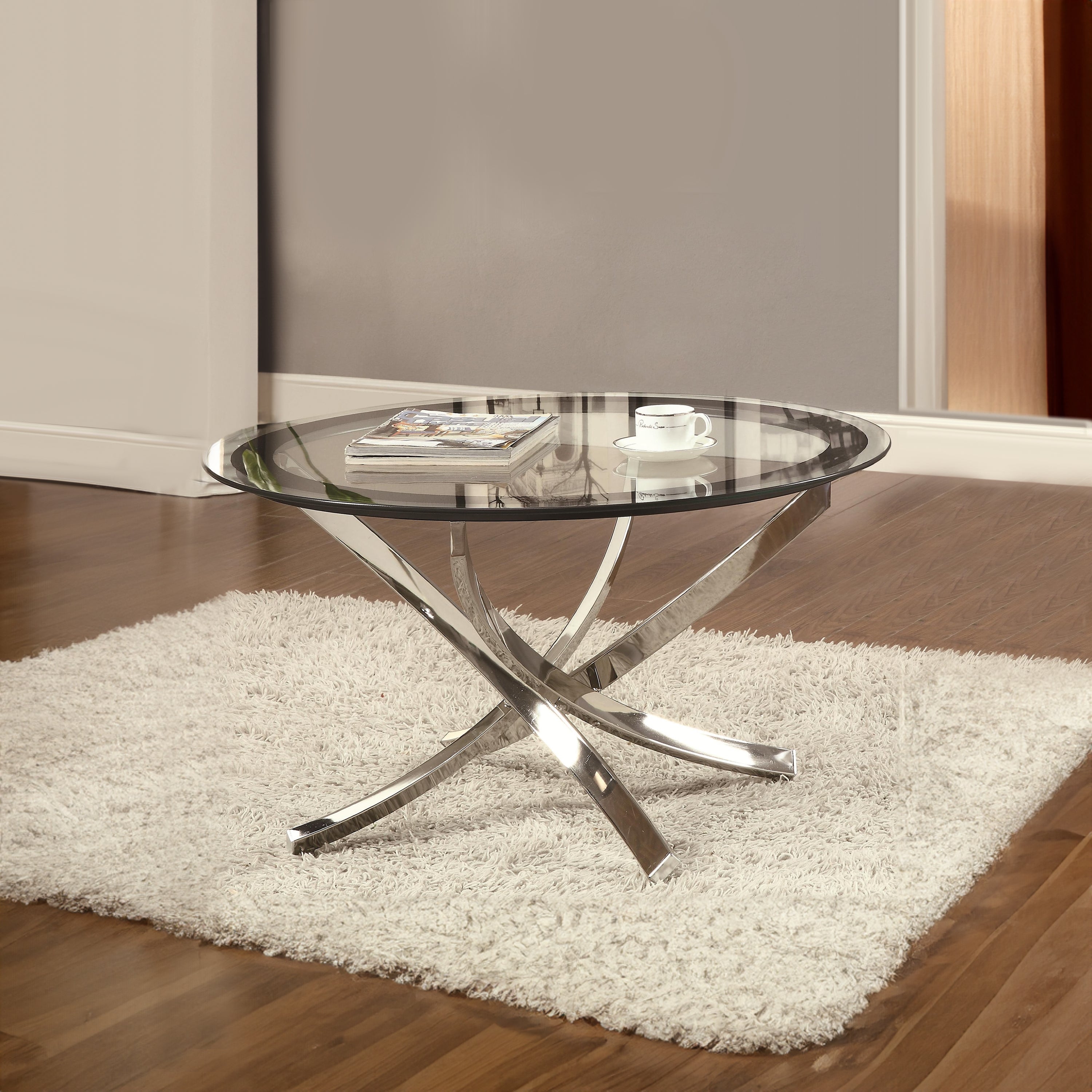 Benjara Round Tempered Glass Top Coffee Table with Metal Legs, Silver And Clear