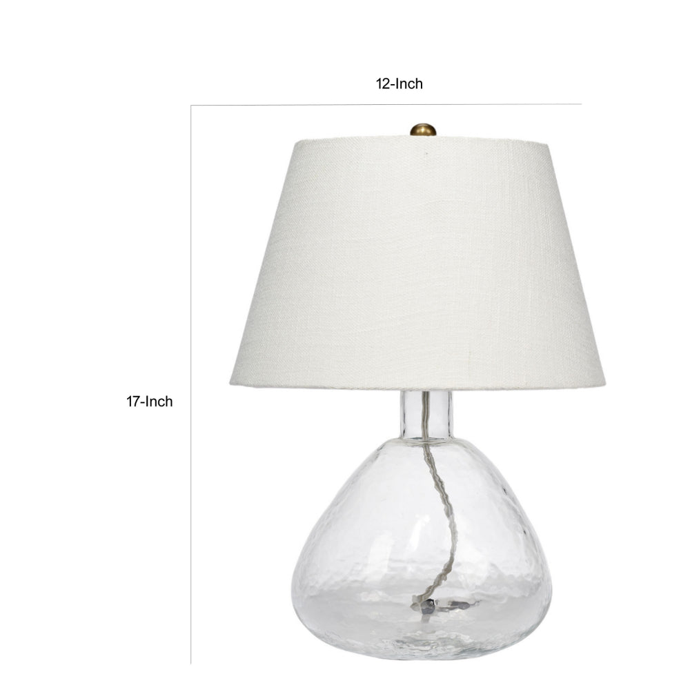 Benjara Navi 17 Inch Table Lamp, White Linen Drum Shade, Clear Glass Curved Body