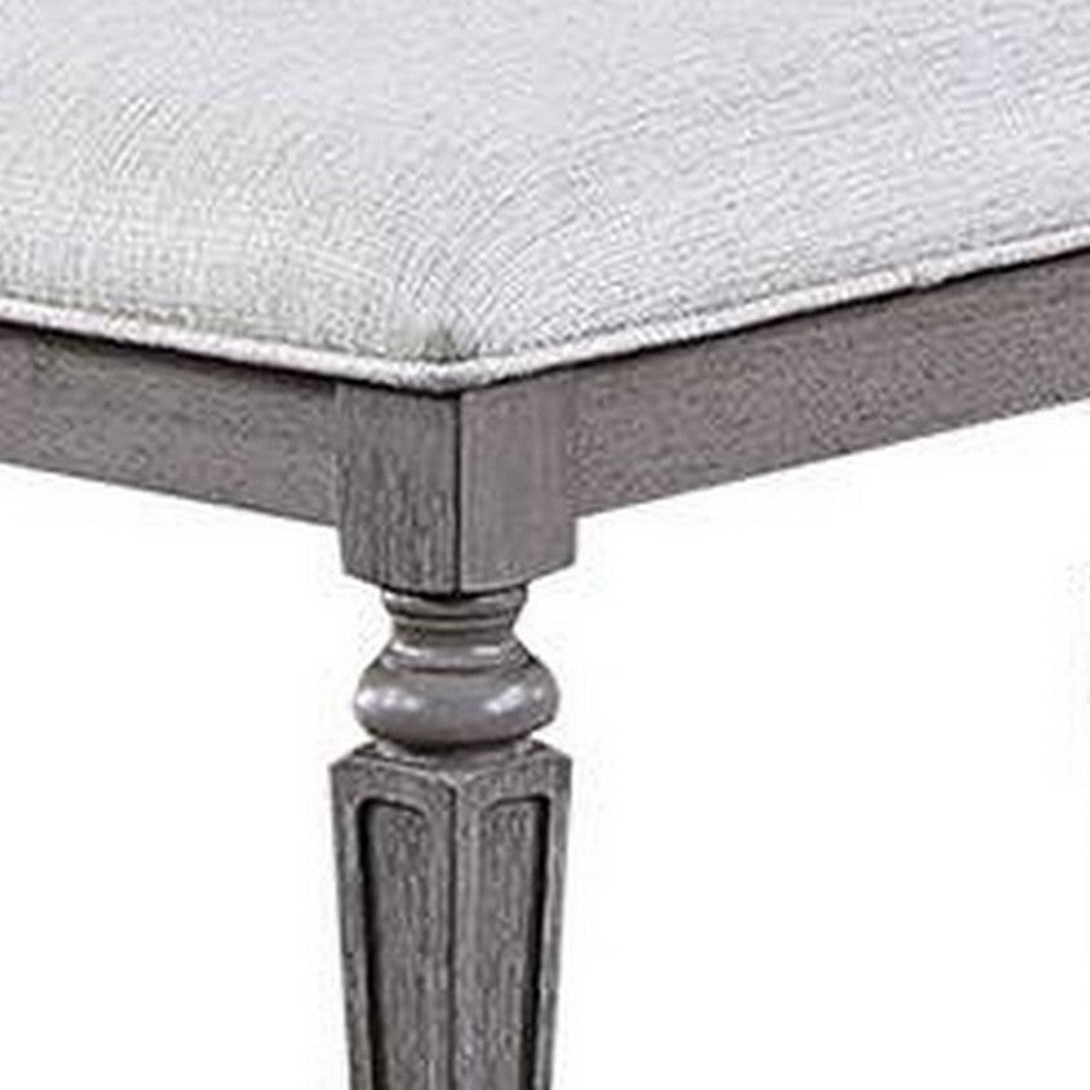 Benjara Winie Dining Bench with Turned Legs, 64 Inch Gray Wood And Fabric