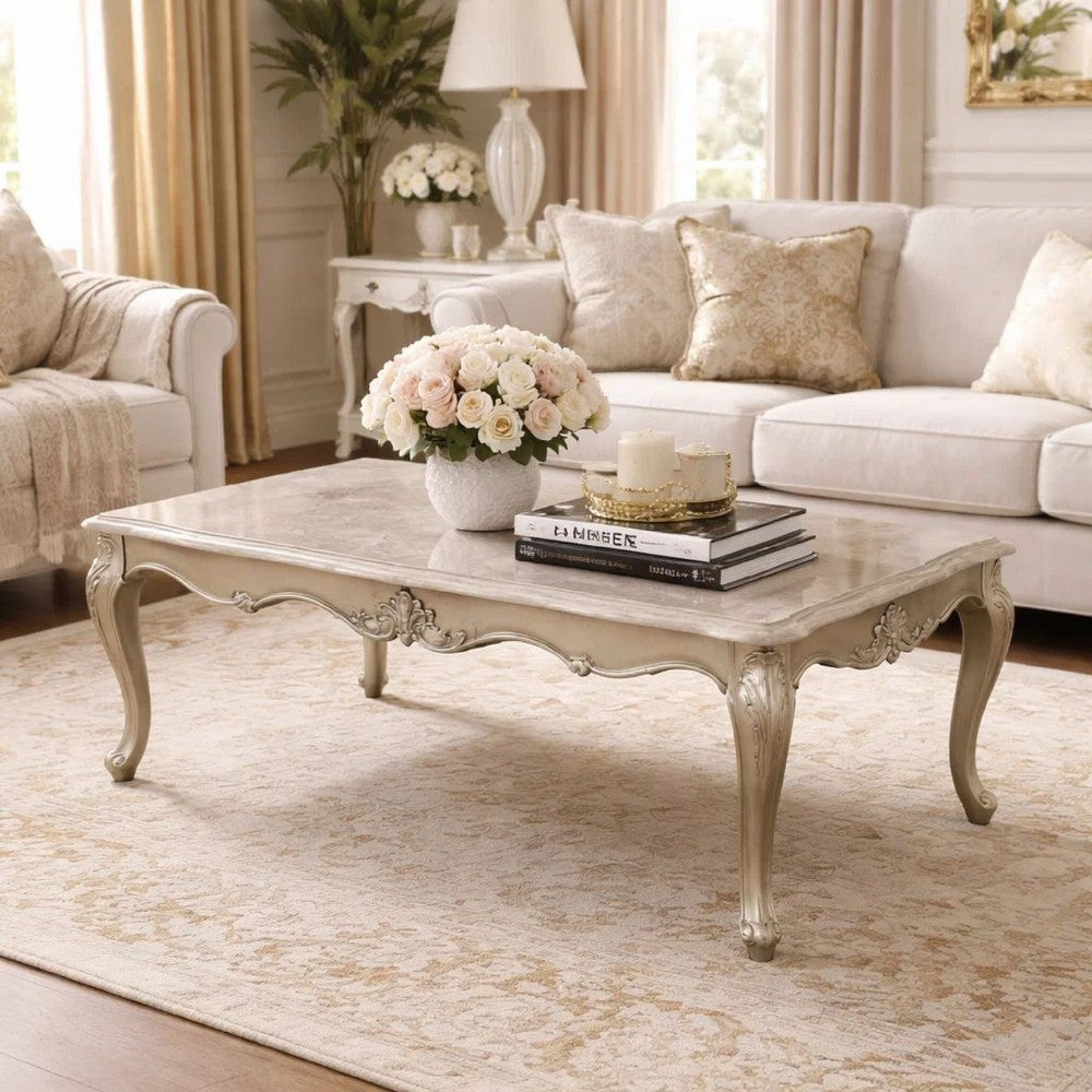 Benjara Kerra Cocktail Coffee Table, Beige Marble, Carved Champagne 54 Inch
