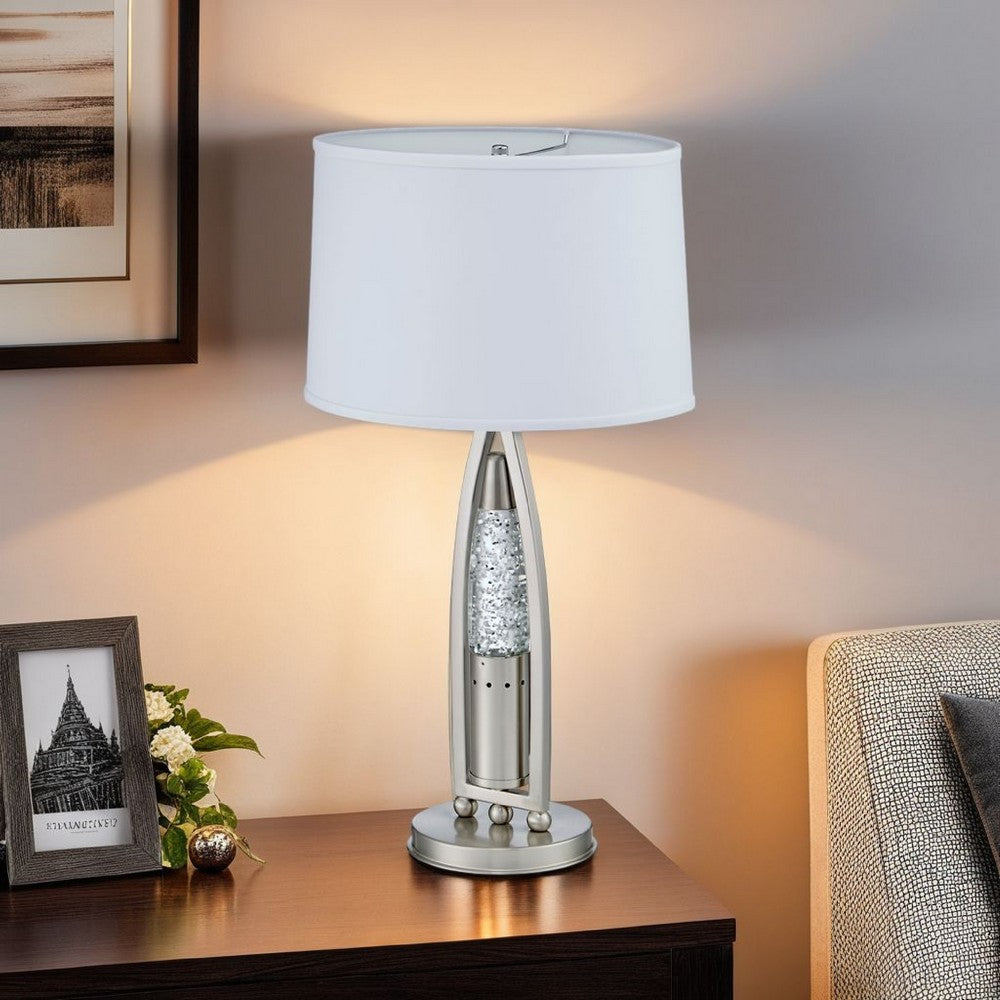 Benjara Danie Table Lamp, 4 Way Switch, Clear Glass Tube, Silver Metal 28 Inch