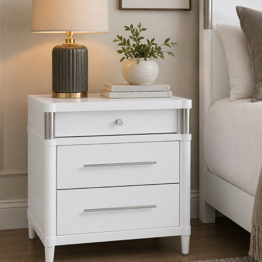 Benjara Ruvie Nightstand with 3 Drawers, Metal Post Accent, White Wood 26 Inch
