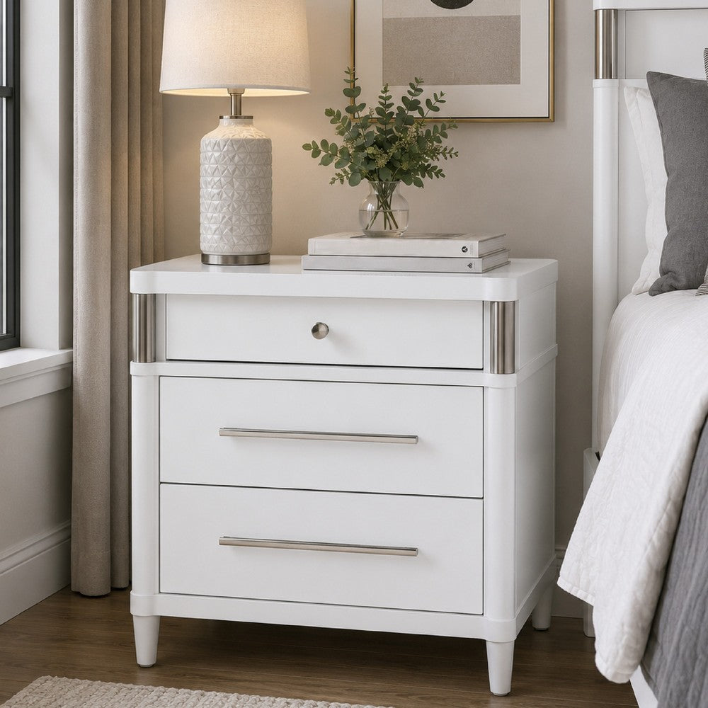 Benjara Ruvie Nightstand with 3 Drawers, Metal Post Accent, White Wood 26 Inch
