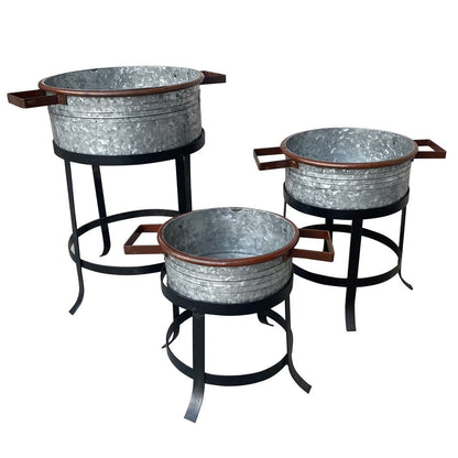 The Urban Port 21, 18, And 16 Inch 3 Piece Round Tub Metal Planter Set with Stand in Galvanized Gray And Black Iron