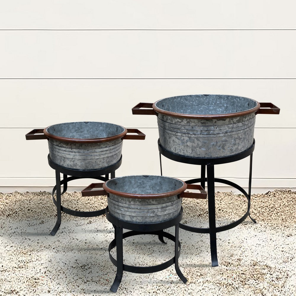 The Urban Port 21, 18, And 16 Inch 3 Piece Round Tub Metal Planter Set with Stand in Galvanized Gray And Black Iron