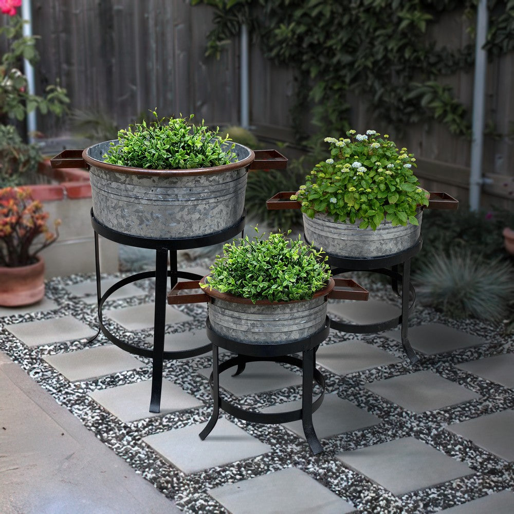 The Urban Port 21, 18, And 16 Inch 3 Piece Round Tub Metal Planter Set with Stand in Galvanized Gray And Black Iron