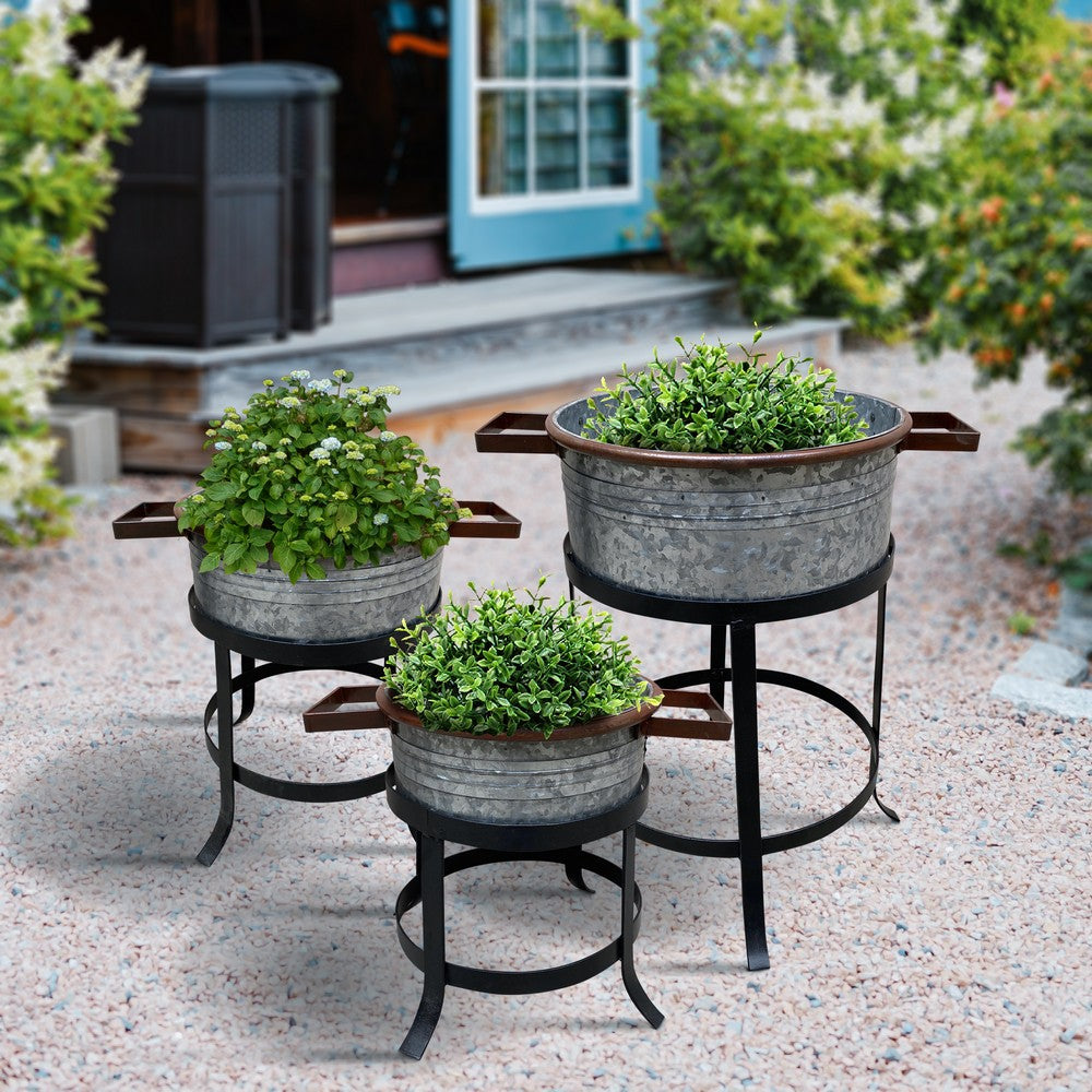 The Urban Port 21, 18, And 16 Inch 3 Piece Round Tub Metal Planter Set with Stand in Galvanized Gray And Black Iron
