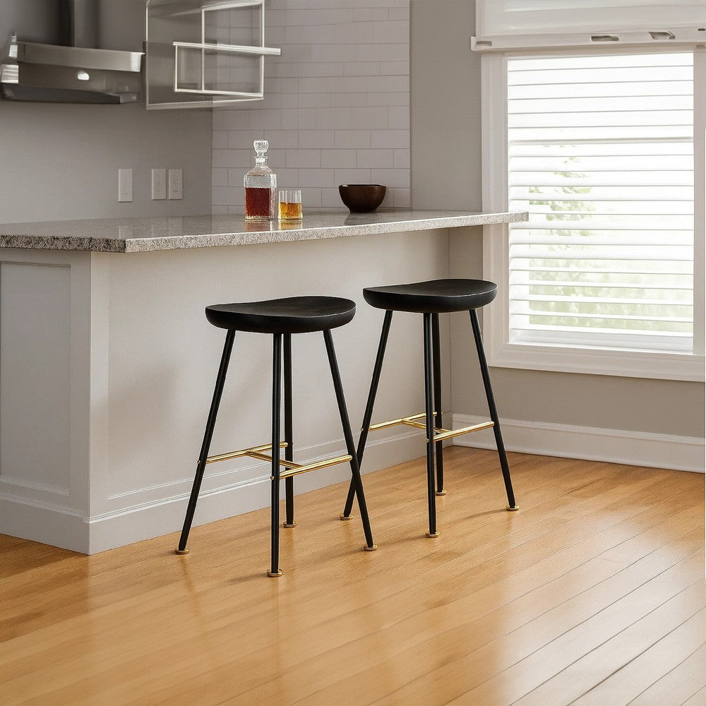 The Urban Port Elira 24" Backless Counter Stool with Mango Wood Saddle Seat | Black Iron Legs | Gold Footrest