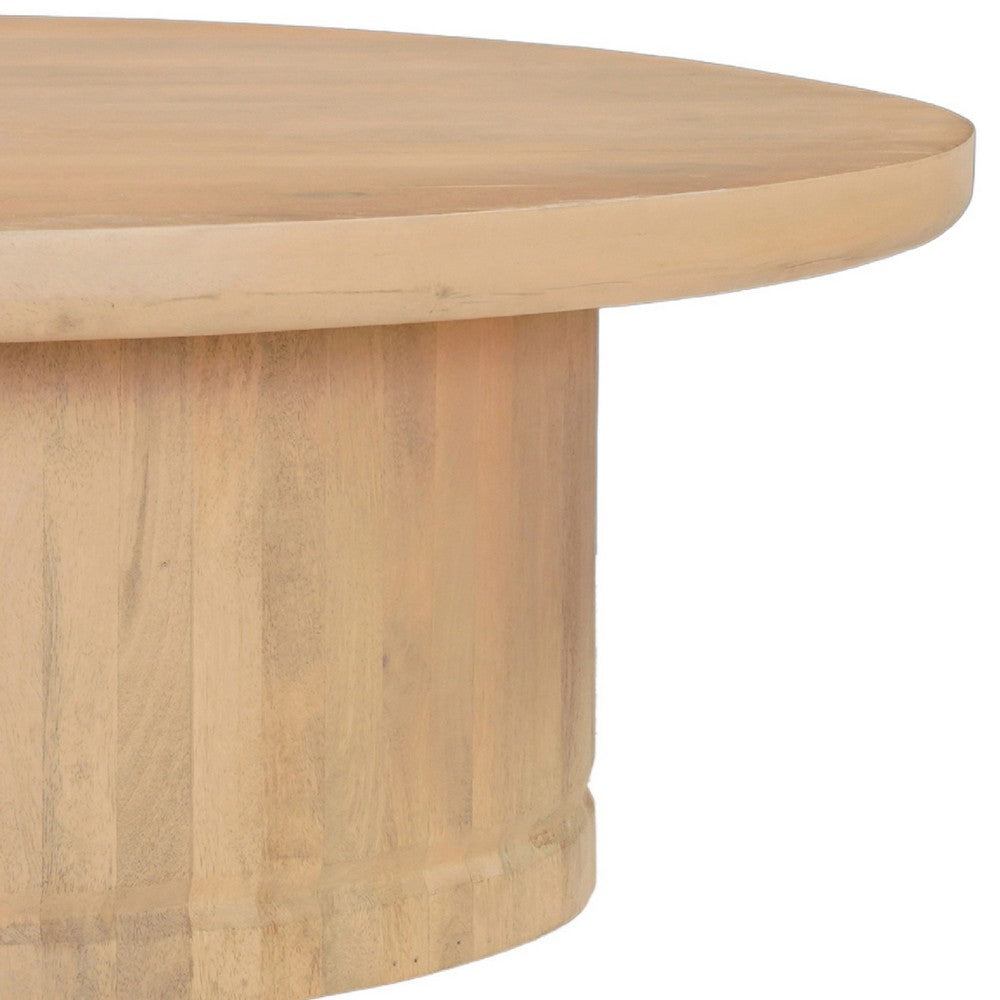 The Urban Port Bela Coffee Table | 47 Inch Round Top | Handcrafted Beige Mango Wood Pedestal Base